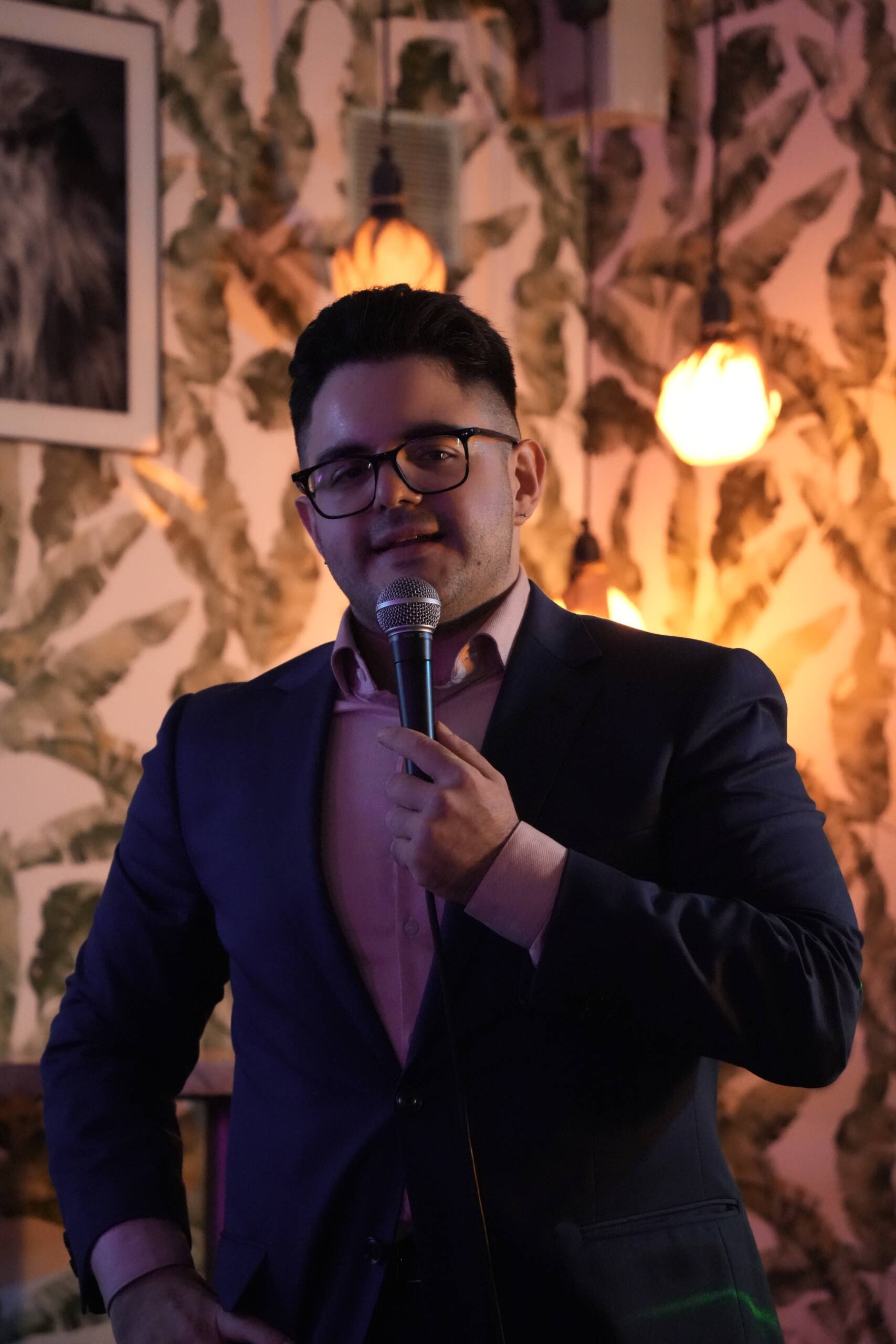 Comedian performing stand-up on stage at Madrid Comedy Festival