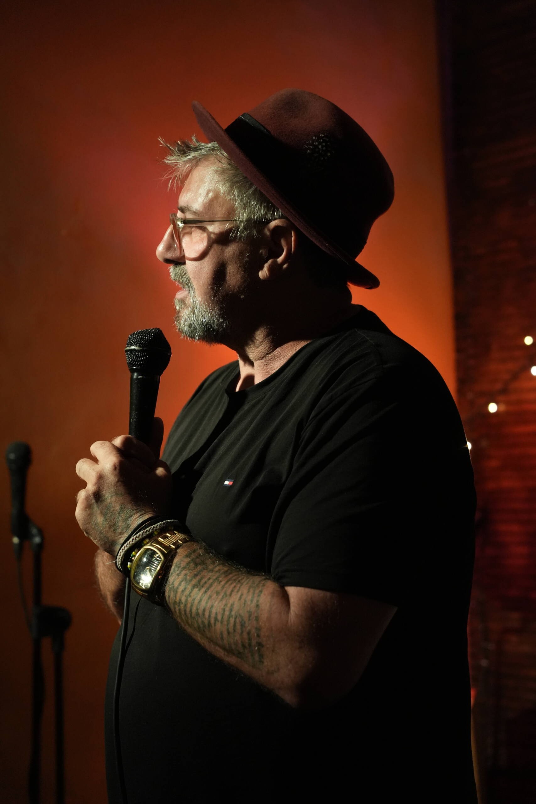 Couple watching a live comedy show in a small Madrid venue
