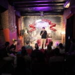 On stage during a comedy night at Madrid Comedy Festival