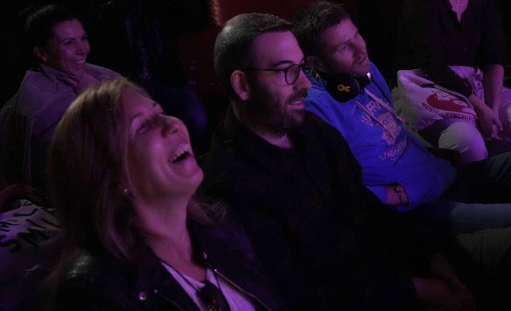 Comedian performing stand-up on stage at Madrid Comedy Festival