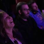 Comedian performing stand-up on stage at Madrid Comedy Festival