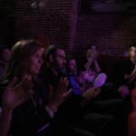 Comedian performing stand-up on stage at Madrid Comedy Festival