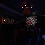 Comedian performing stand-up on stage at Madrid Comedy Festival