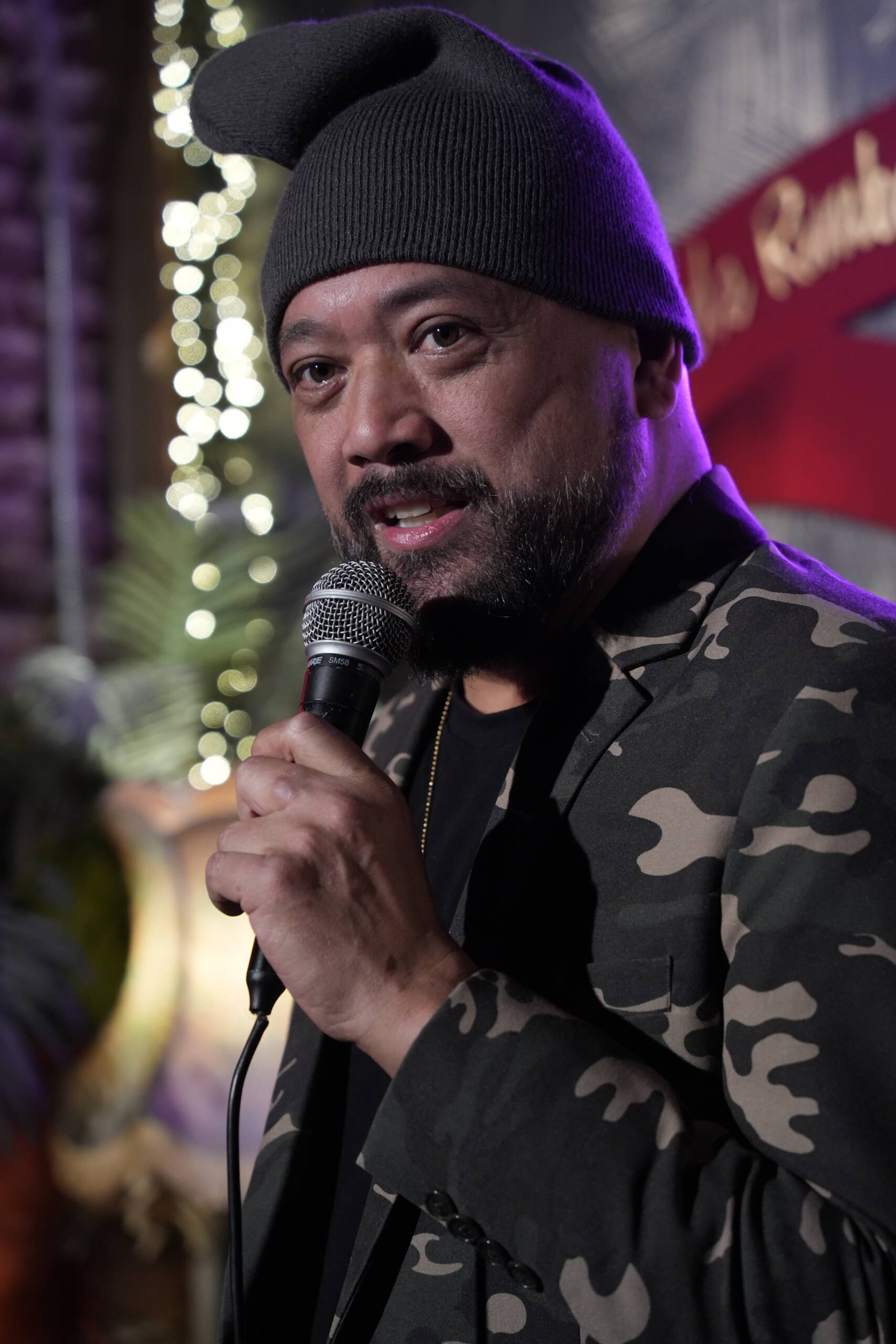 Comedian performing stand-up on stage at Madrid Comedy Festival
