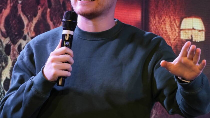 A comedian at the microphone during a Madrid Comedy Festival show
