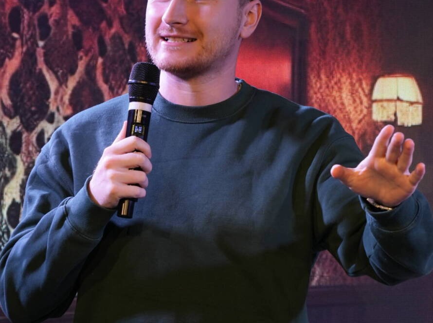 A comedian at the microphone during a Madrid Comedy Festival show