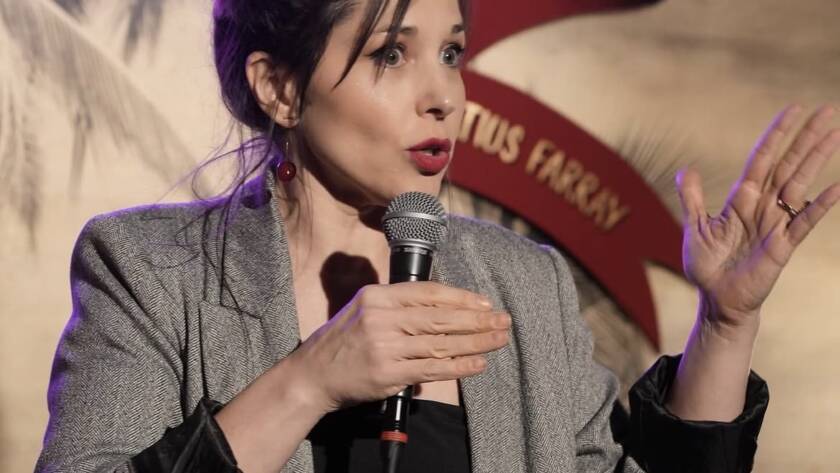 Comedian performing stand-up on stage at Madrid Comedy Festival